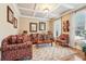 Inviting living room features coffered ceilings, large windows, and elegant furnishings at 4802 Moon Chase Dr, Buford, GA 30519