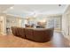 Spacious living room with a large sectional sofa, tile floors, and a flat screen TV at 4802 Moon Chase Dr, Buford, GA 30519