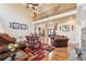 Open-concept living room features a high ceiling, hardwood floors, and comfortable seating at 4802 Moon Chase Dr, Buford, GA 30519