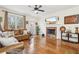 Comfortable living room features a fireplace, TV, and view of the outdoor patio at 4802 Moon Chase Dr, Buford, GA 30519
