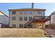 Home exterior with two-story deck, backyard, and mature trees at 4802 Moon Chase Dr, Buford, GA 30519
