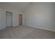 Bright bedroom with plush carpeting and closet at 490 Charleston Pl, Villa Rica, GA 30180