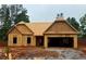 Exterior of new construction home shows the framing and garage; awaiting finishing and personalization at 490 Charleston Pl, Villa Rica, GA 30180