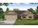 Charming single-story home with brick accents, a two-car garage, and a well-manicured lawn at 490 Charleston Pl, Villa Rica, GA 30180