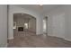 Bright living room featuring hardwood floors, an archway, and a fireplace at 490 Charleston Pl, Villa Rica, GA 30180