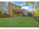 Expansive backyard featuring a wooden deck and lush lawn at 823 Valley Dr, Canton, GA 30114