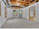Unfinished basement showing some electrical work, windows, and exterior door at 823 Valley Dr, Canton, GA 30114