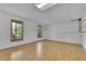 Unfinished basement with unfinished walls, windows and wood floor at 823 Valley Dr, Canton, GA 30114