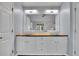 Bathroom vanity featuring double sinks, updated lighting and dark wood countertop at 823 Valley Dr, Canton, GA 30114