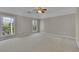 Spacious bedroom with carpeted floor and large windows overlooking green landscape at 823 Valley Dr, Canton, GA 30114