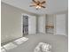 View of a light-filled bedroom featuring neutral walls and carpet with a ceiling fan at 823 Valley Dr, Canton, GA 30114
