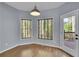 Charming breakfast nook with hardwood floors and views of the wooded area at 823 Valley Dr, Canton, GA 30114