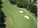 Expansive golf course view featuring manicured green fairways and sand traps at 823 Valley Dr, Canton, GA 30114