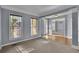 Bright living room with carpet, neutral colors, and connecting dining area, offers an inviting space at 823 Valley Dr, Canton, GA 30114