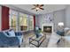 Cozy living room with fireplace, large windows, and comfortable seating at 823 Valley Dr, Canton, GA 30114