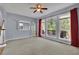 Spacious living room with a fireplace, large windows, and access to the deck at 823 Valley Dr, Canton, GA 30114