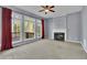 Bright living room featuring a fireplace, and large windows with natural light at 823 Valley Dr, Canton, GA 30114
