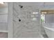 Close up of the marble tiled shower with glass enclosure at 823 Valley Dr, Canton, GA 30114