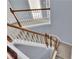 Carpeted staircase with white risers and a wood handrail at 823 Valley Dr, Canton, GA 30114