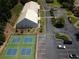 Aerial view of tennis/pickleball courts next to the parking lot and community center at 823 Valley Dr, Canton, GA 30114