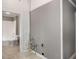 Bathroom featuring shower/tub combo, toilet and sink with access to the laundry and storage at 1290 Campbellton Sw Rd, Atlanta, GA 30310