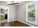 Cozy dining room with hardwood floors, neutral walls, large window and modern light fixture at 1290 Campbellton Sw Rd, Atlanta, GA 30310