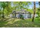 Charming home surrounded by mature trees and lush green lawn at 1290 Campbellton Sw Rd, Atlanta, GA 30310