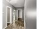 Hallway featuring wood floors and white trim throughout at 1290 Campbellton Sw Rd, Atlanta, GA 30310