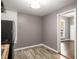 Compact kitchen featuring stainless steel appliances, wood countertops, and light gray walls at 1290 Campbellton Sw Rd, Atlanta, GA 30310