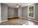 The living room features wood floors, a ceiling fan, and natural light at 1290 Campbellton Sw Rd, Atlanta, GA 30310