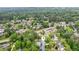 Beautiful aerial view of a home with lush landscaping and a private pool in a serene, wooded neighborhood at 2724 Saddle Ridge Lake Dr, Marietta, GA 30062