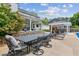 Spacious backyard with pool, patio, bar, and mature trees, perfect for outdoor living at 2724 Saddle Ridge Lake Dr, Marietta, GA 30062
