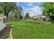 Backyard featuring a well-maintained lawn and a shed, enhancing the property's appeal at 2724 Saddle Ridge Lake Dr, Marietta, GA 30062
