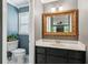 Elegant powder room features a decorative mirror, marble countertop, and classic fixtures at 2724 Saddle Ridge Lake Dr, Marietta, GA 30062