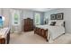 Cozy bedroom with a decorative bed frame, dresser, and natural light from the windows at 2724 Saddle Ridge Lake Dr, Marietta, GA 30062