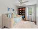 Bright bedroom featuring a daybed, white rug, and a bookcase for storage and style at 2724 Saddle Ridge Lake Dr, Marietta, GA 30062