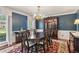 Elegant dining room featuring a hardwood floor, a chandelier, and an exquisite china cabinet at 2724 Saddle Ridge Lake Dr, Marietta, GA 30062