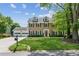 Beautiful two-story brick home with a well-maintained lawn, dormer windows, and a two-car garage at 2724 Saddle Ridge Lake Dr, Marietta, GA 30062