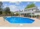 A gorgeous backyard pool with a bar and grill area is perfect for entertaining and relaxing at 2724 Saddle Ridge Lake Dr, Marietta, GA 30062