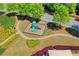 Overhead view of a neighborhood playground with walking paths and manicured landscaping at 702 Village Field Ct, Suwanee, GA 30024