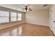This bedroom offers hardwood floors and ample natural light at 702 Village Field Ct, Suwanee, GA 30024