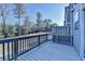 Deck features wood railing and wooded view at 702 Village Field Ct, Suwanee, GA 30024