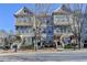 A row of charming two-story townhomes offers a blend of brick and siding exteriors at 702 Village Field Ct, Suwanee, GA 30024