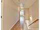 Open upstairs hallway with wood floors leading to multiple rooms and staircase at 702 Village Field Ct, Suwanee, GA 30024