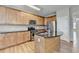Kitchen with stainless appliances and wood island at 702 Village Field Ct, Suwanee, GA 30024
