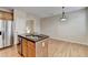 Kitchen island with stainless steel appliances and bar seating at 702 Village Field Ct, Suwanee, GA 30024