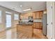 Eat in Kitchen with island, stainless steel appliances, and access to the patio at 702 Village Field Ct, Suwanee, GA 30024