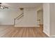 Open living room with hardwood floors and staircase for a spacious interior design at 702 Village Field Ct, Suwanee, GA 30024