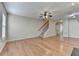 Expansive living room with hardwood floors, a staircase, and neutral decor for versatile styling at 702 Village Field Ct, Suwanee, GA 30024