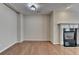 Bright living room featuring hardwood floors, fireplace, and natural light at 702 Village Field Ct, Suwanee, GA 30024